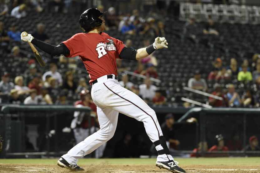 Third baseman Joey Gallo watches his three-run home run to win the game, against the Midland...