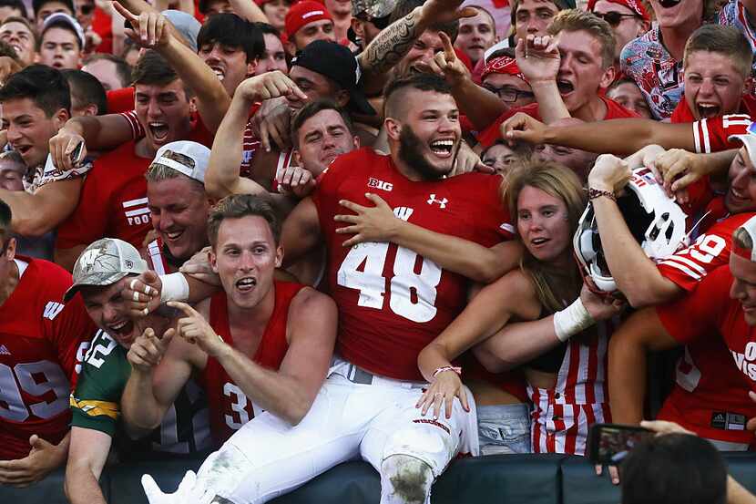 GREEN BAY, WI - SEPTEMBER 03: Jack Cichy #48 of the Wisconsin Badgers celebrates with fans...