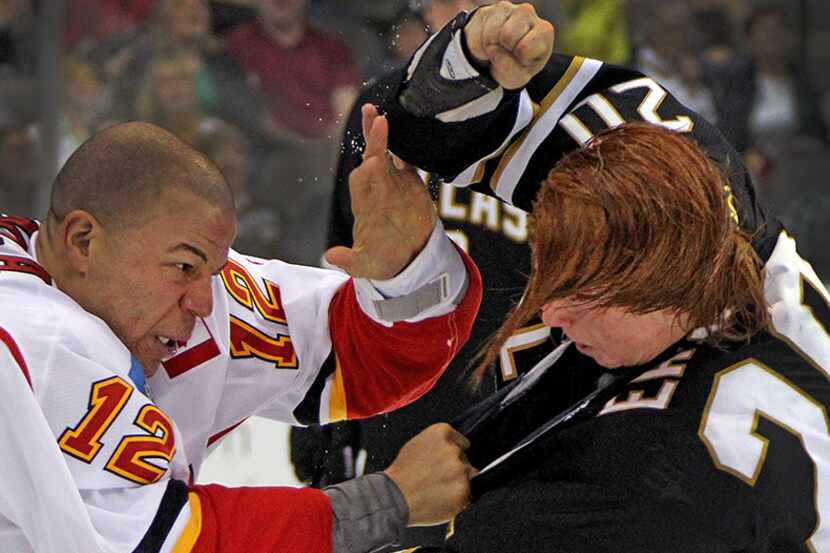  March 18, 2013--Dallas' Cody Eakin (20) is bloodied but fights the good fight against...