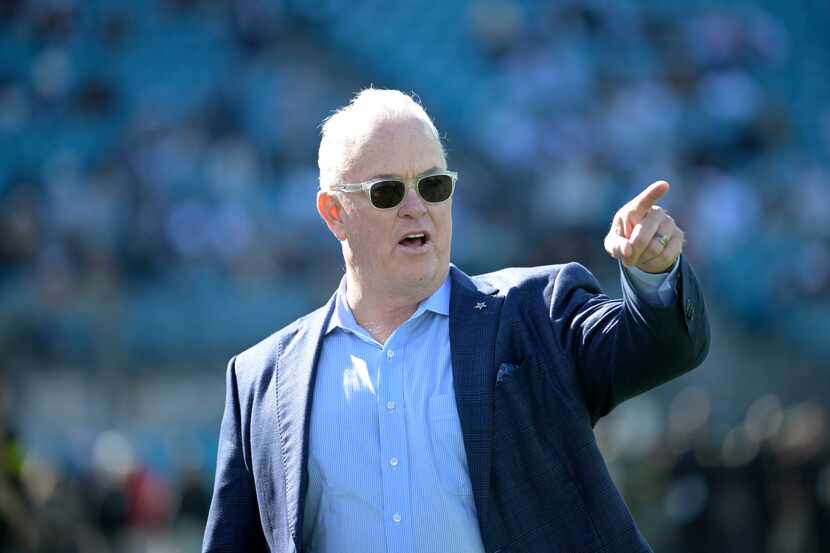 Dallas Cowboys director of player personnel Stephen Jones watches from the sideline as...