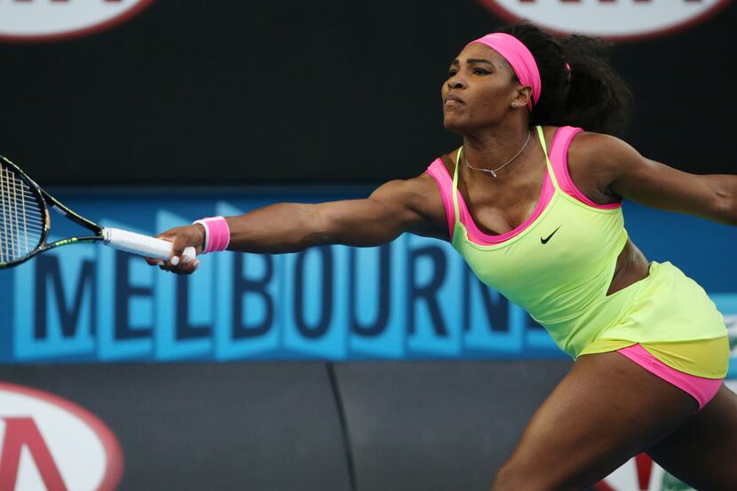Serena Williams of the U.S. makes a forehand return to Alison Van Uytvanck of Belgium during...