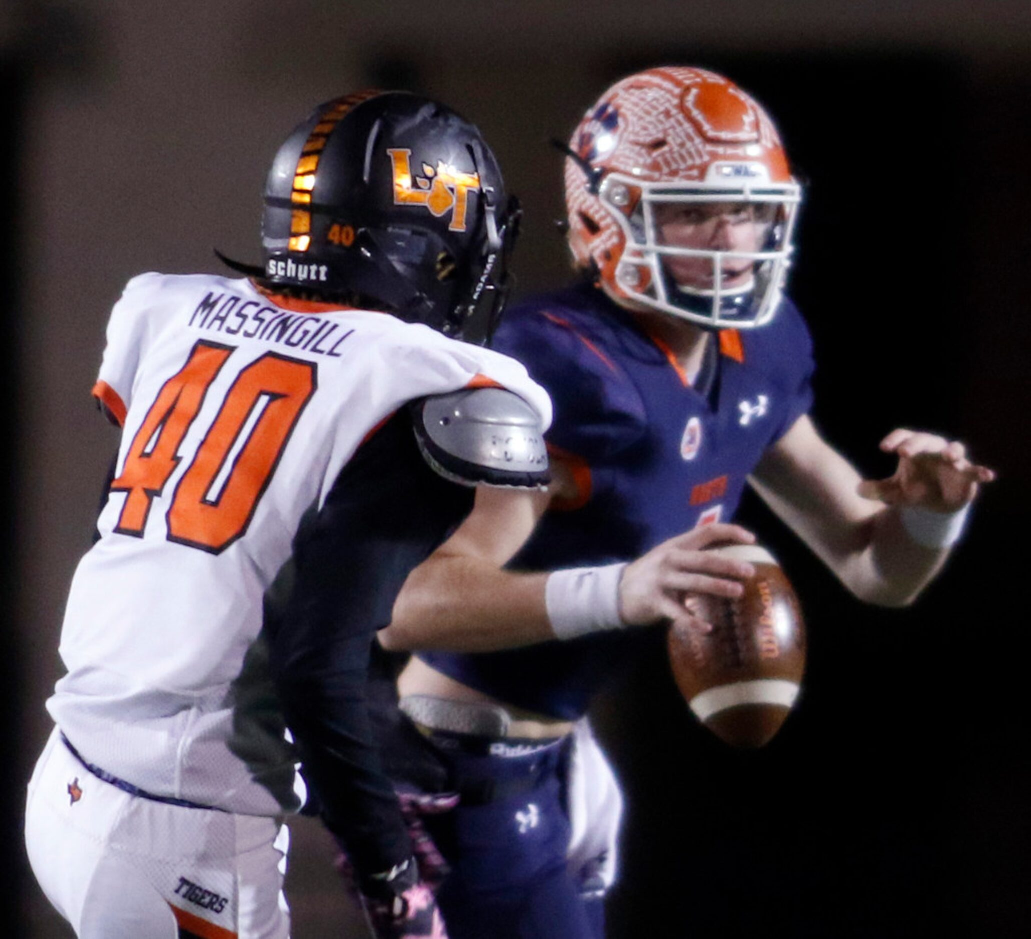 McKinney North quarterback Brandon Mankiewicz (4) looks for an open receiver as he is...