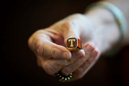 Legendary Texas women's basketball coach Jody Conradt holds her Longhorns T-Ring on...