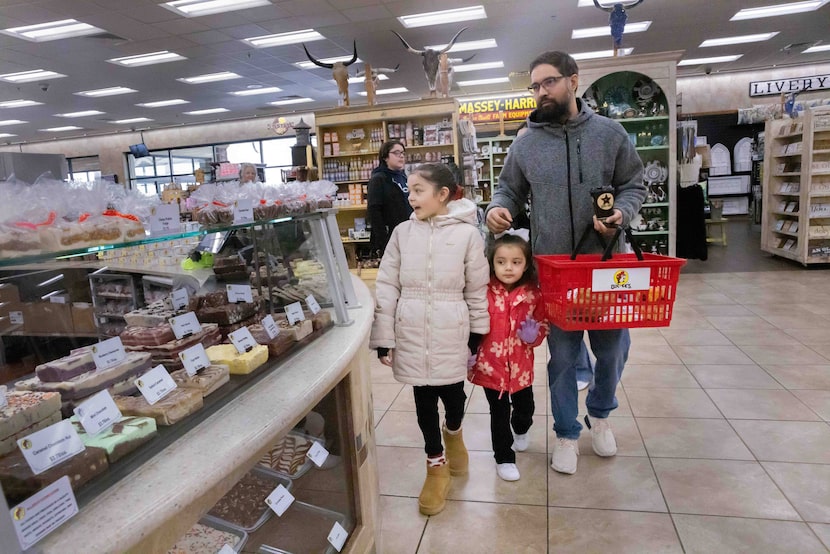 (From right) Matthew Jimenez of Bedford and daughters Amelia Jimenez, 4, and Alyssa Jimenez,...