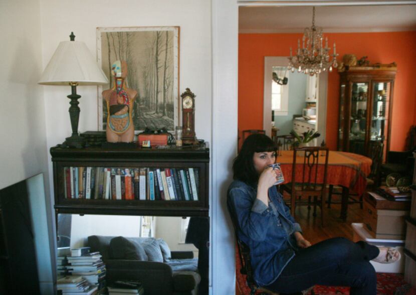 BODIES AT REST: Art historian and gallery owner Cris Worley — the house is hers — drinks...