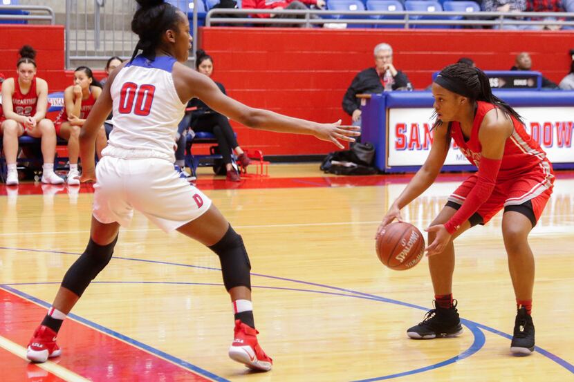 Irving MaArthur's Sarah Andrews (right) ranks among the area leaders in scoring, assists and...