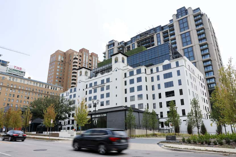 Traffic passes along Maple Avenue with a view of Maple Terrace on July 27, 2024, in Uptown...