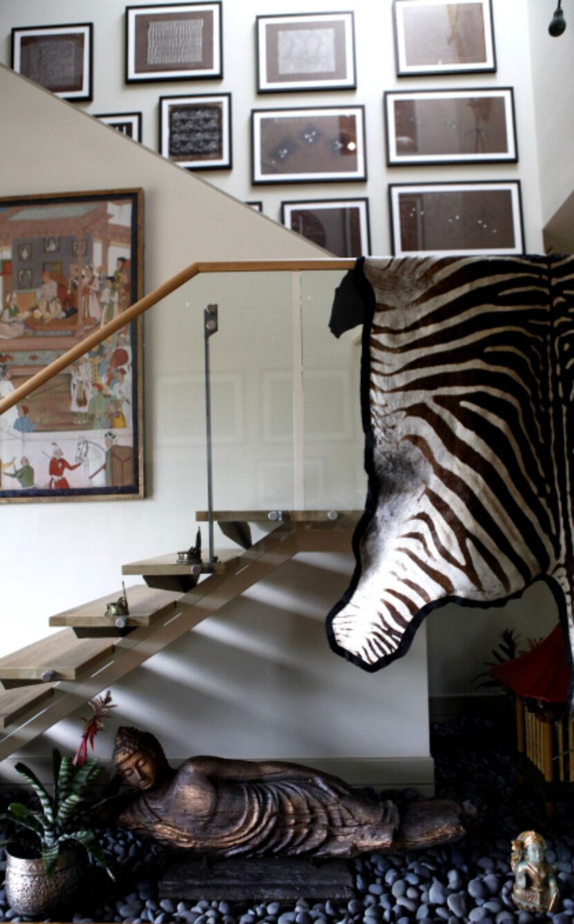 The staircase at the home of D'Andra Simmons and Jeremy Lock in Dallas. The contemporary...