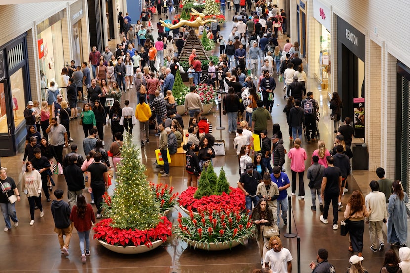 Black Friday shoppers walk through NorthPark Center, Friday, Nov. 24, 2023, in Dallas. 