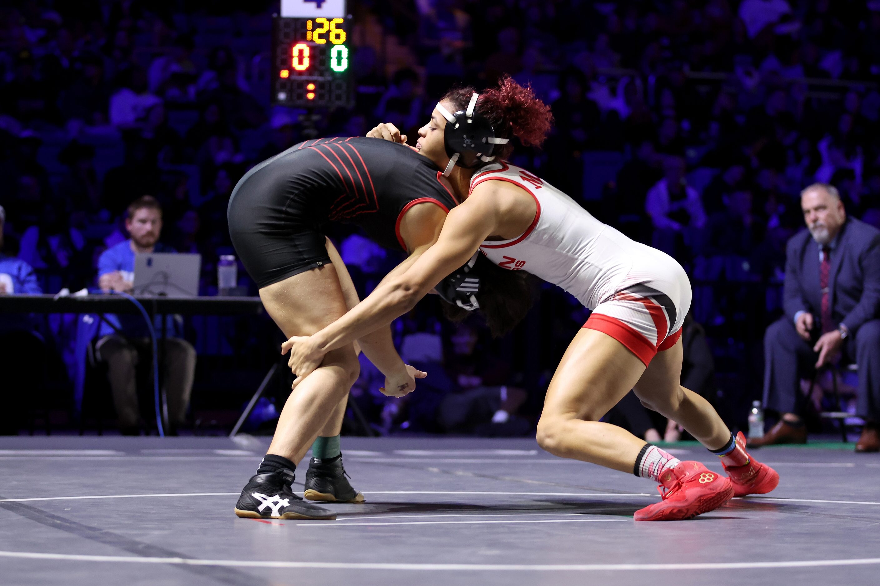 Jania Dunigan of Arlington Martin (white) competes against Sarah Conner of Richardson Lake...