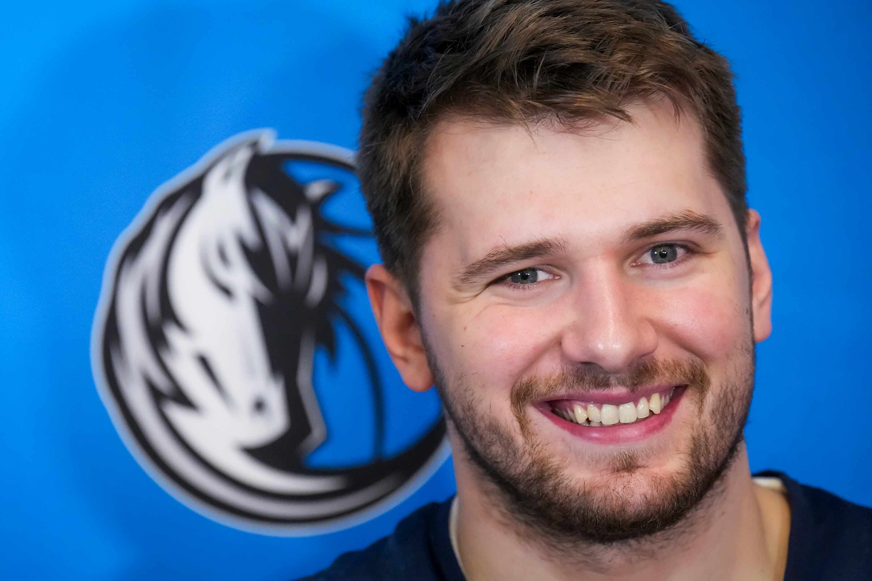Dallas Mavericks guard Luka Doncic smiles he addresses reporters after the team practiced in...