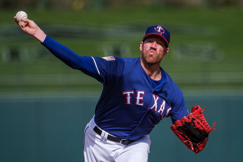 Texas Rangers pitcher Zach McAllister pitches during the second inning of a spring training...