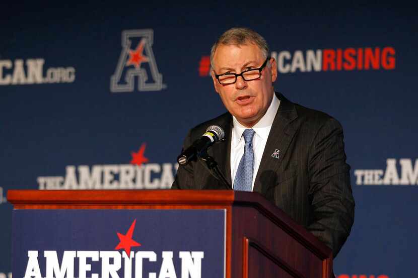 FILE - In this Aug. 4, 2015, file photo, American Athletic Conference Commissioner Mike...