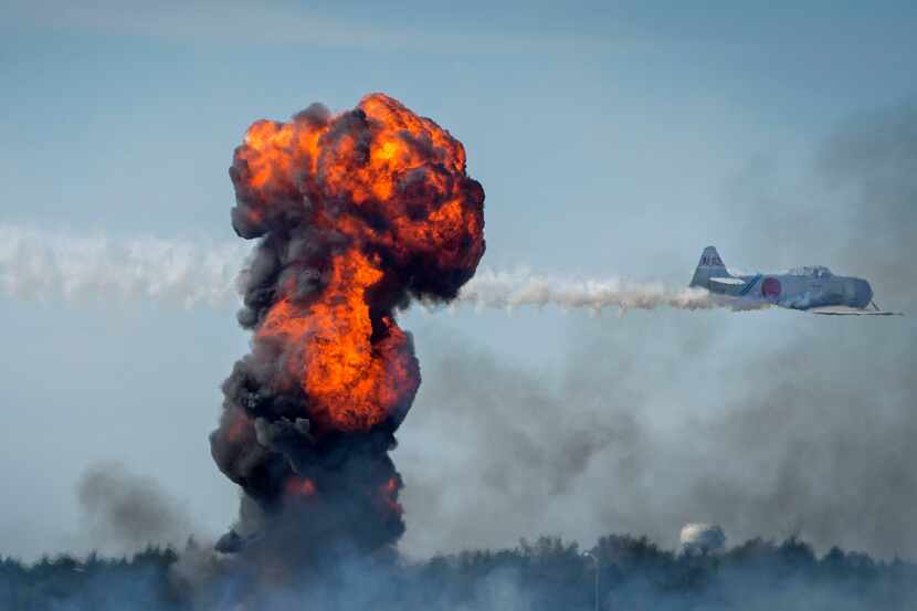 Explosions fill the sky during the Commemorative Air Force Wings Over Dallas WWII Airshow...