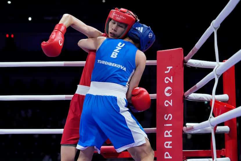 Taiwan's Lin Yu-ting, left, fights Uzbekistan's Sitora Turdibekova in their women's 57 kg...
