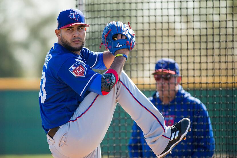 Texas Rangers pitcher Martin Perez throws live batting practice during a spring training...