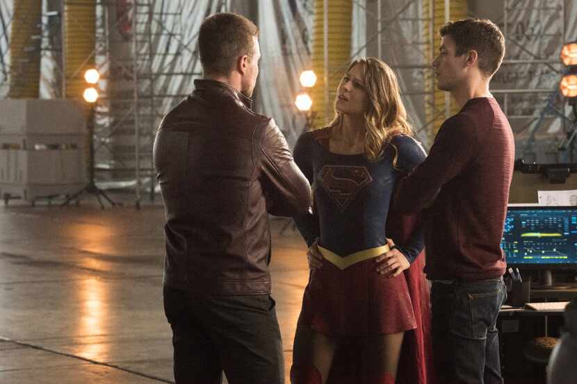 Stephen Amell is Oliver Queen, Melissa Benoist is Kara/Supergirl and Grant Gustin is Barry...