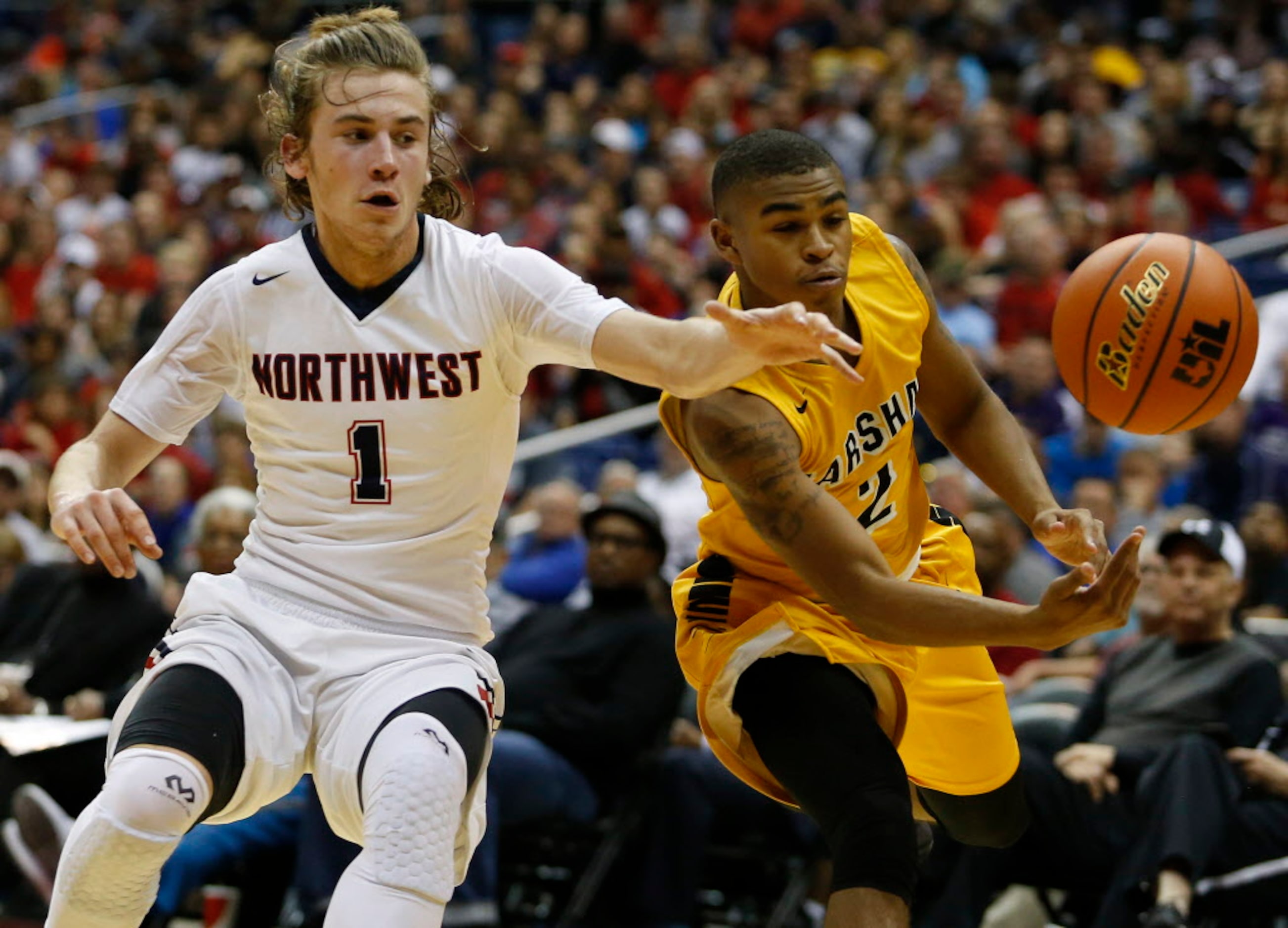 Justin Northwest's Tucker Dunn (1) gets picked by Fort Bend Marshall's Daquazemarr Wyche (2)...