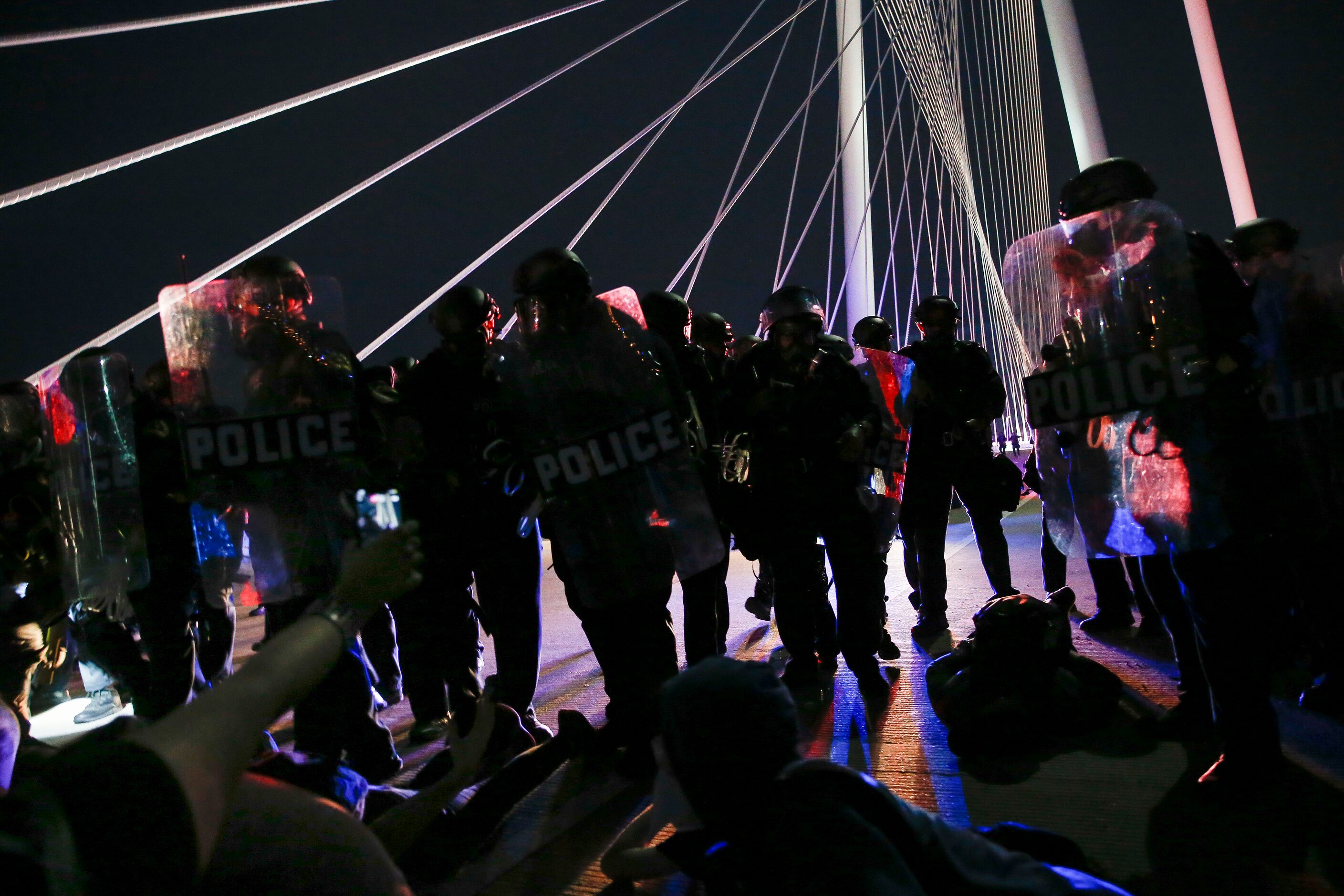 Police surround and detain hundreds of protesters who marched onto the Margaret Hunt Hill...