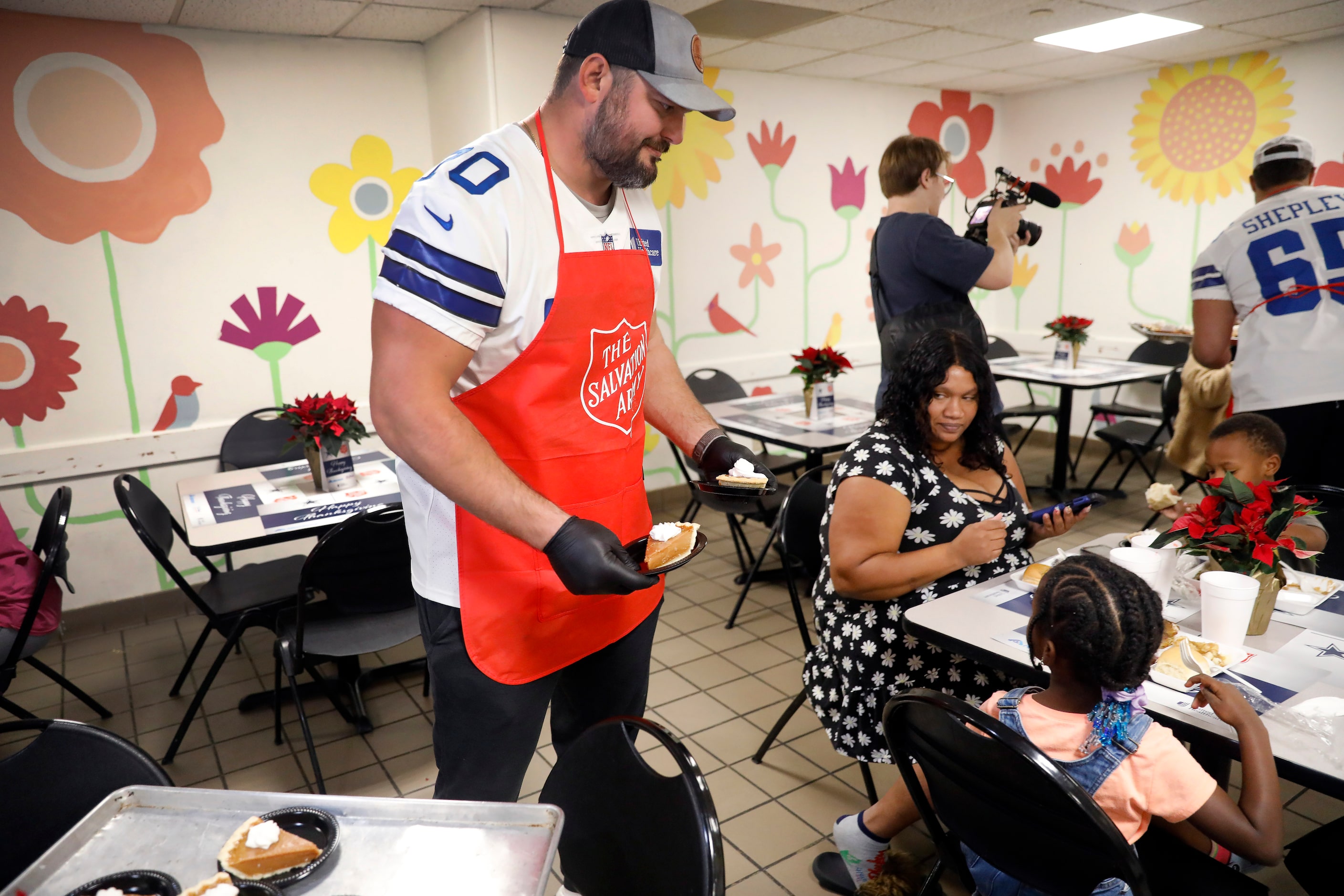 Dallas Cowboys guard Zack Martin and other veteran players served an “Early” Thanksgiving...