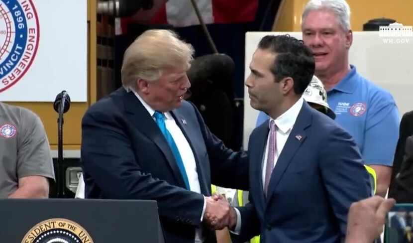 President Donald Trump shook hands with Texas Land Commissioner George P. Bush at an event...