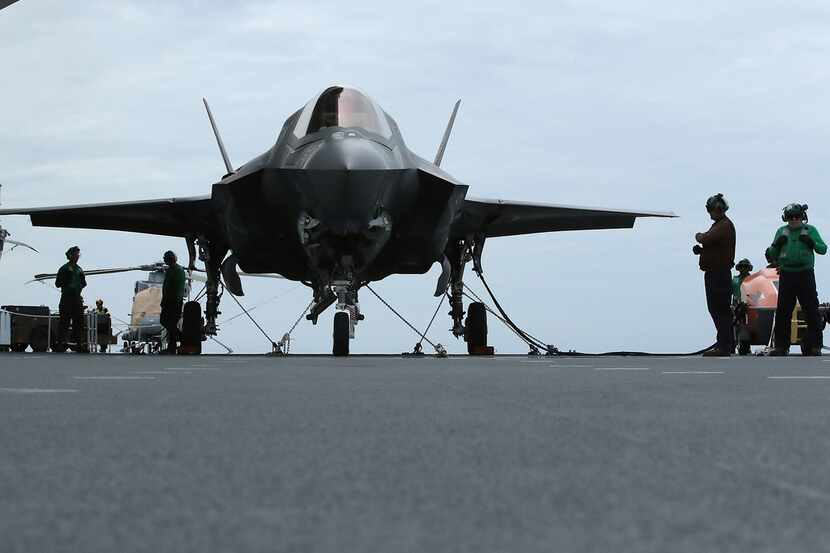 A new F-35B Lightning fighter jet is prepped for take off from the deck of the United...