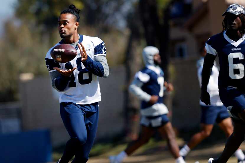 Dallas Cowboys wide receiver Jalen Tolbert (18) pulls in a pass completion during a walk...