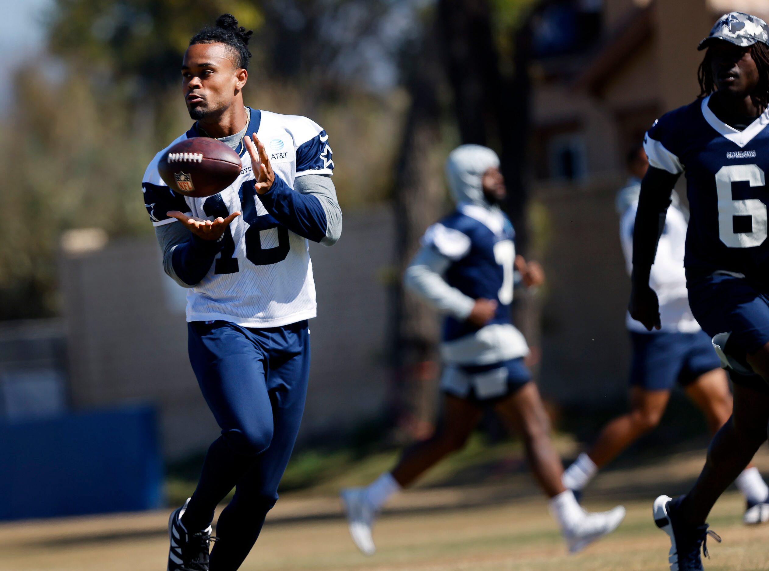 Dallas Cowboys wide receiver Jalen Tolbert (18) pulls in a pass completion during a walk...