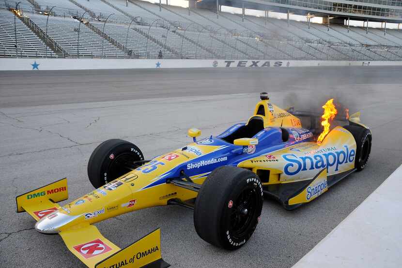 Marco Andretti car burns the apron of turn four during an IndyCar auto race at Texas Motor...