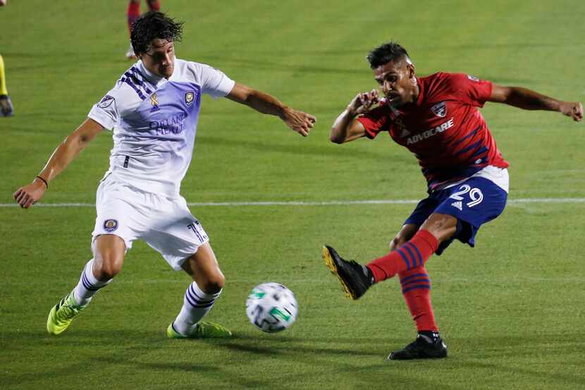 FC Dallas forward Franco Jara (29) attempts a shot in front of Orlando City defender Rodrigo...