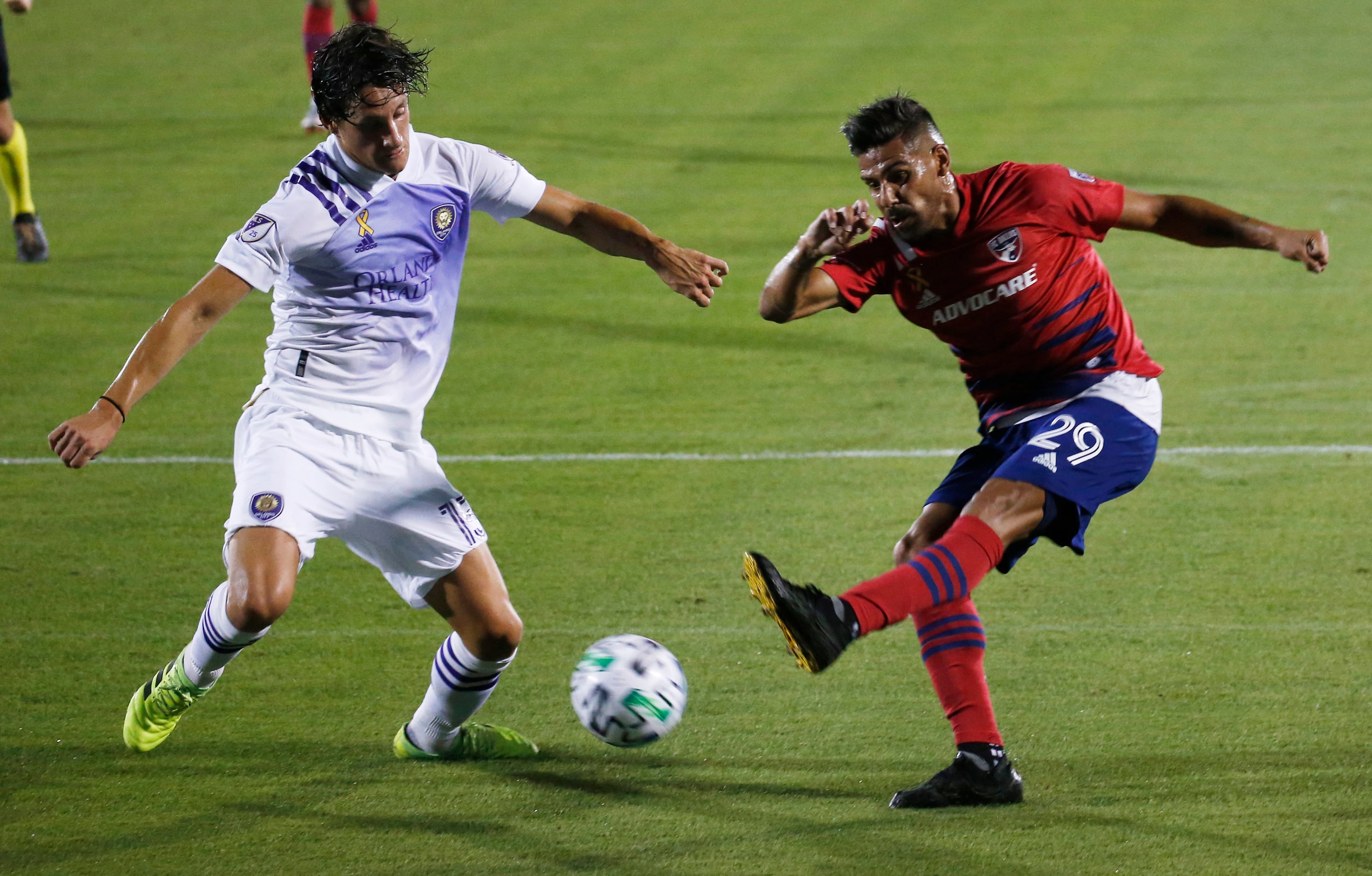 FC Dallas forward Franco Jara (29) attempts a shot in front of Orlando City defender Rodrigo...