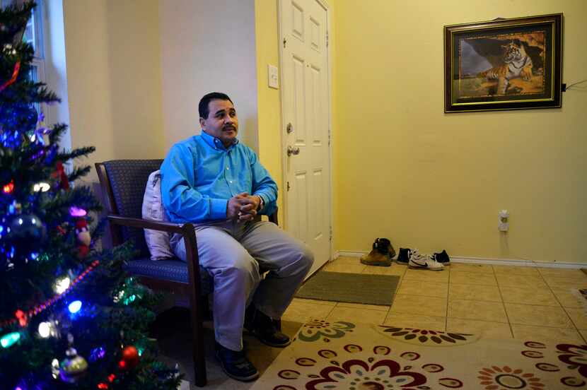 Adan Barahona sits while talking about his daughter in his home on Sunday, December 20, 2015...