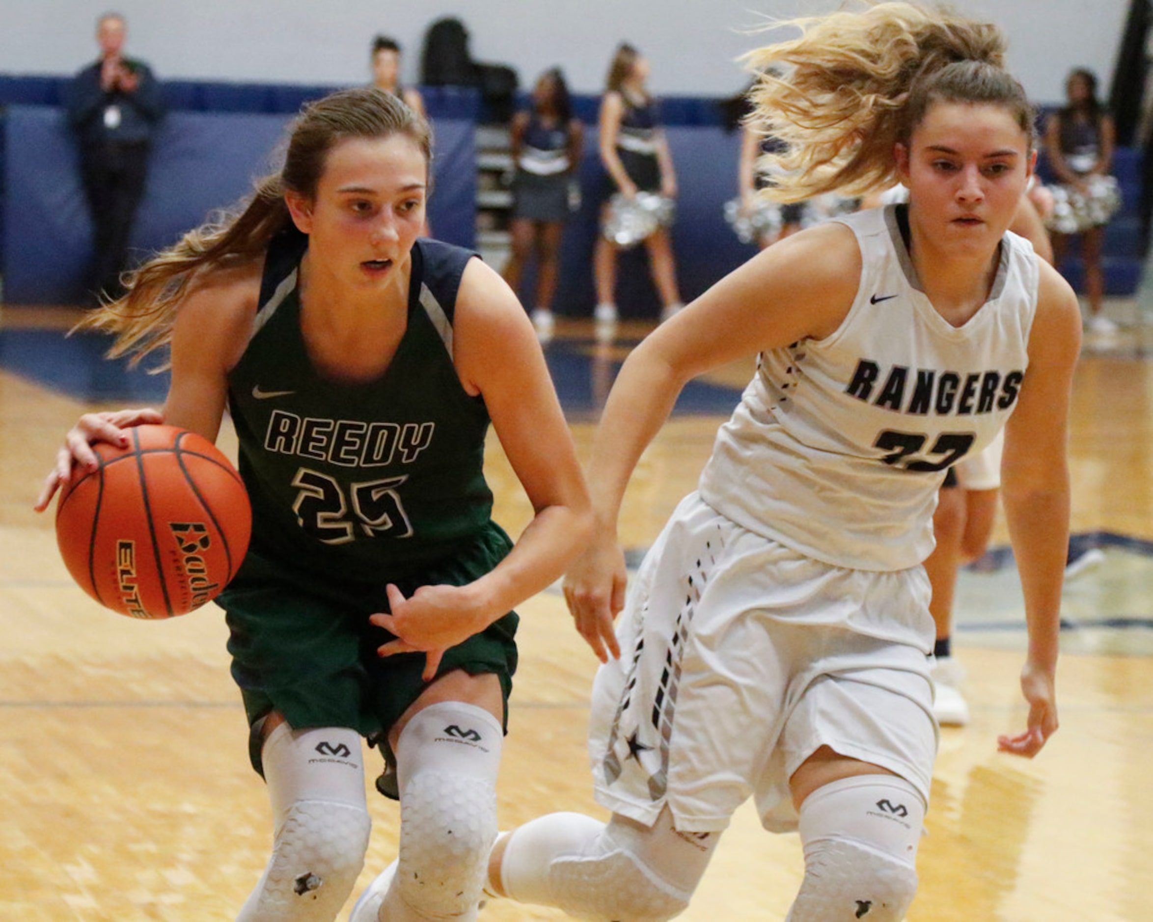 Frisco Reedy's Jadyn Bauss (25) dribbles pass  Frisco Lone Star's Adryana Quezada during...