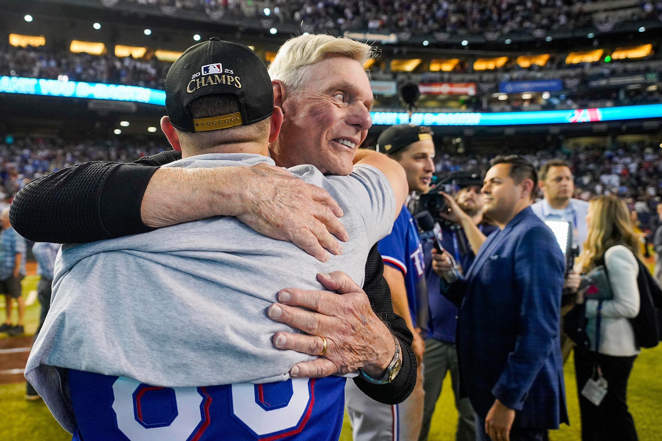 Texas Rangers owner Ray Davis celebrate winning players and coaches after a victory over the...