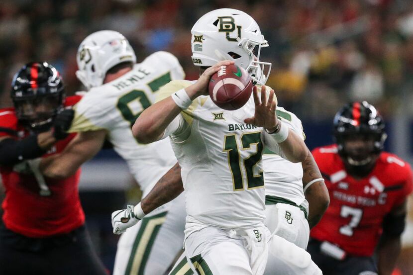 Baylor Bears quarterback Charlie Brewer (12) fires off a pass during the second half of a...