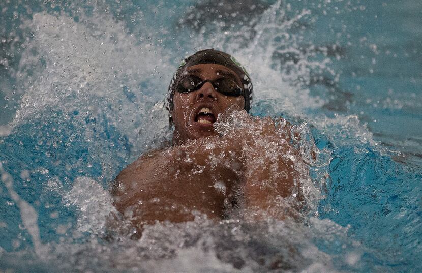 Bryan Adams High School student Abel Fetahi competes in the backstroke during the boys 200...