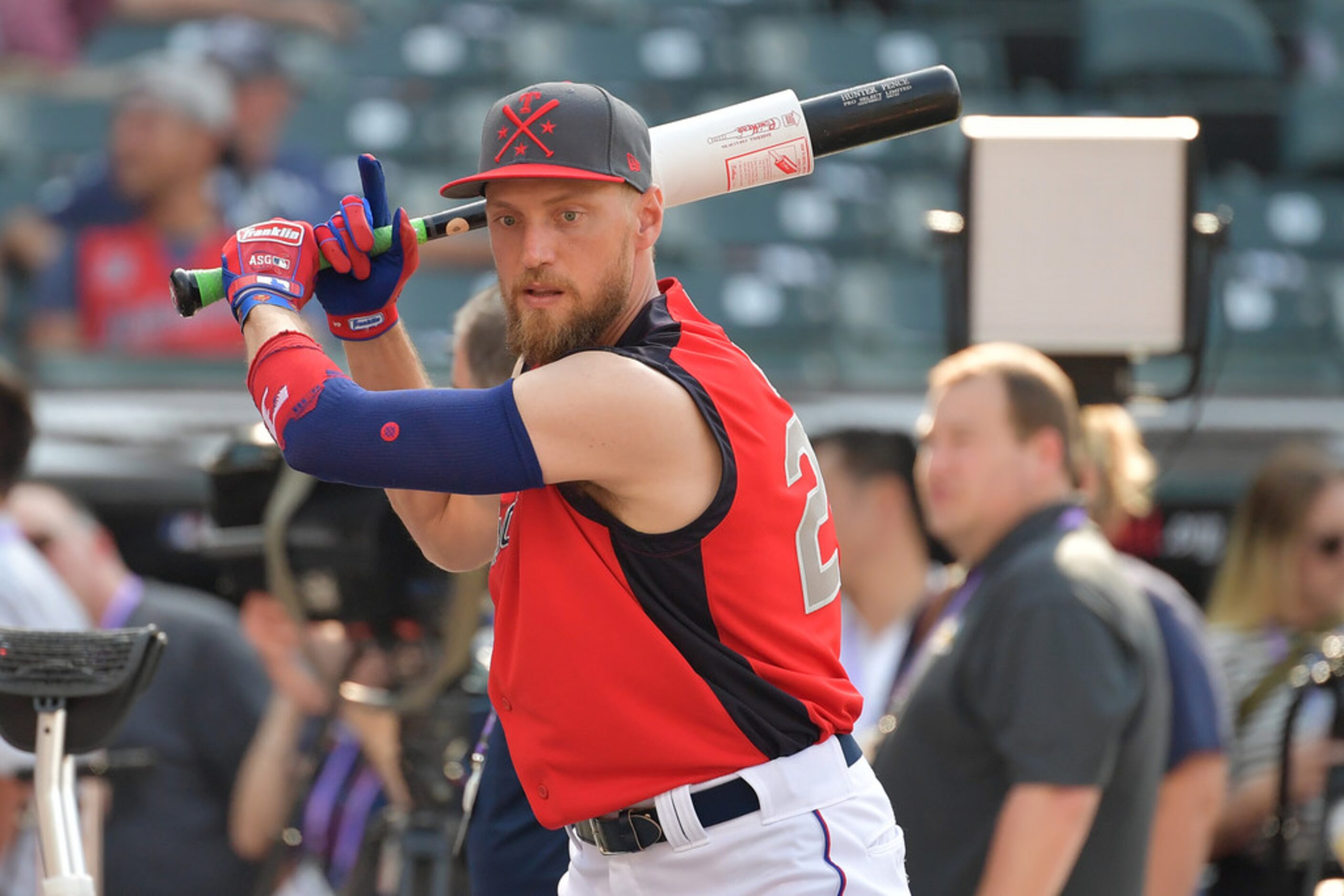 CLEVELAND, OHIO - JULY 09: Hunter Pence #24 of the Texas Rangers warms up prior to the 2019...