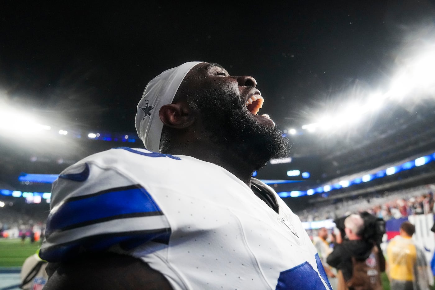 Dallas Cowboys defensive tackle Neville Gallimore celebrates as he leaves the field after a...