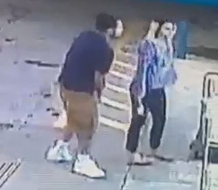 A still photo shows grainy images of two people suspected in an attack at a Fort Worth...