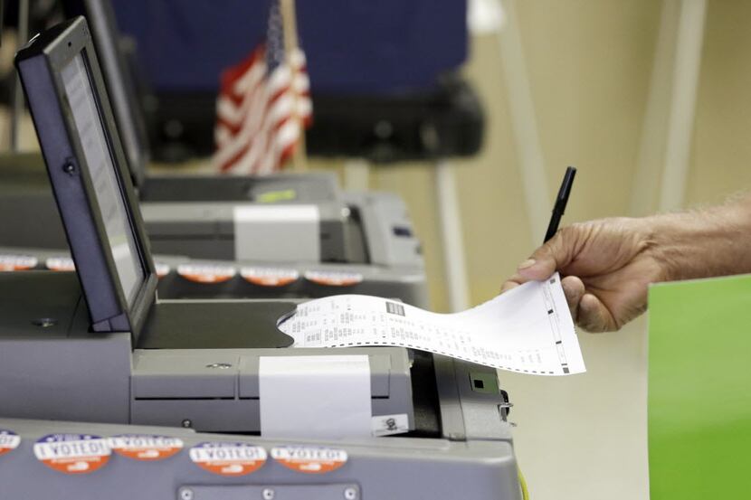 A voter casts his primary vote in Hialeah, Fla. Hacking attempts and leaked emails could...