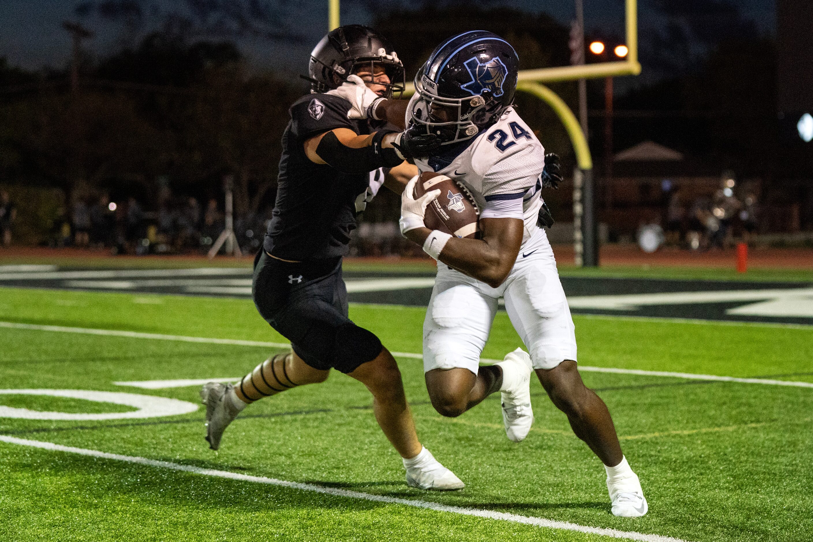 Bishop Lynch junior linebacker Weston Pomykal (8) grabs the face mask of Argyle Liberty...