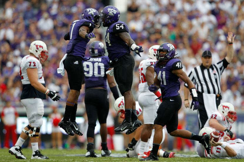 File: TCU's Chris Hackett (1) and Marcus Mallet (54) celebrate after Mallet sacked SMU...