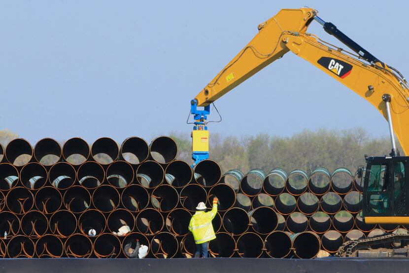FILE - In this May 9, 2015 file photo, pipes for the proposed Dakota Access oil pipeline...