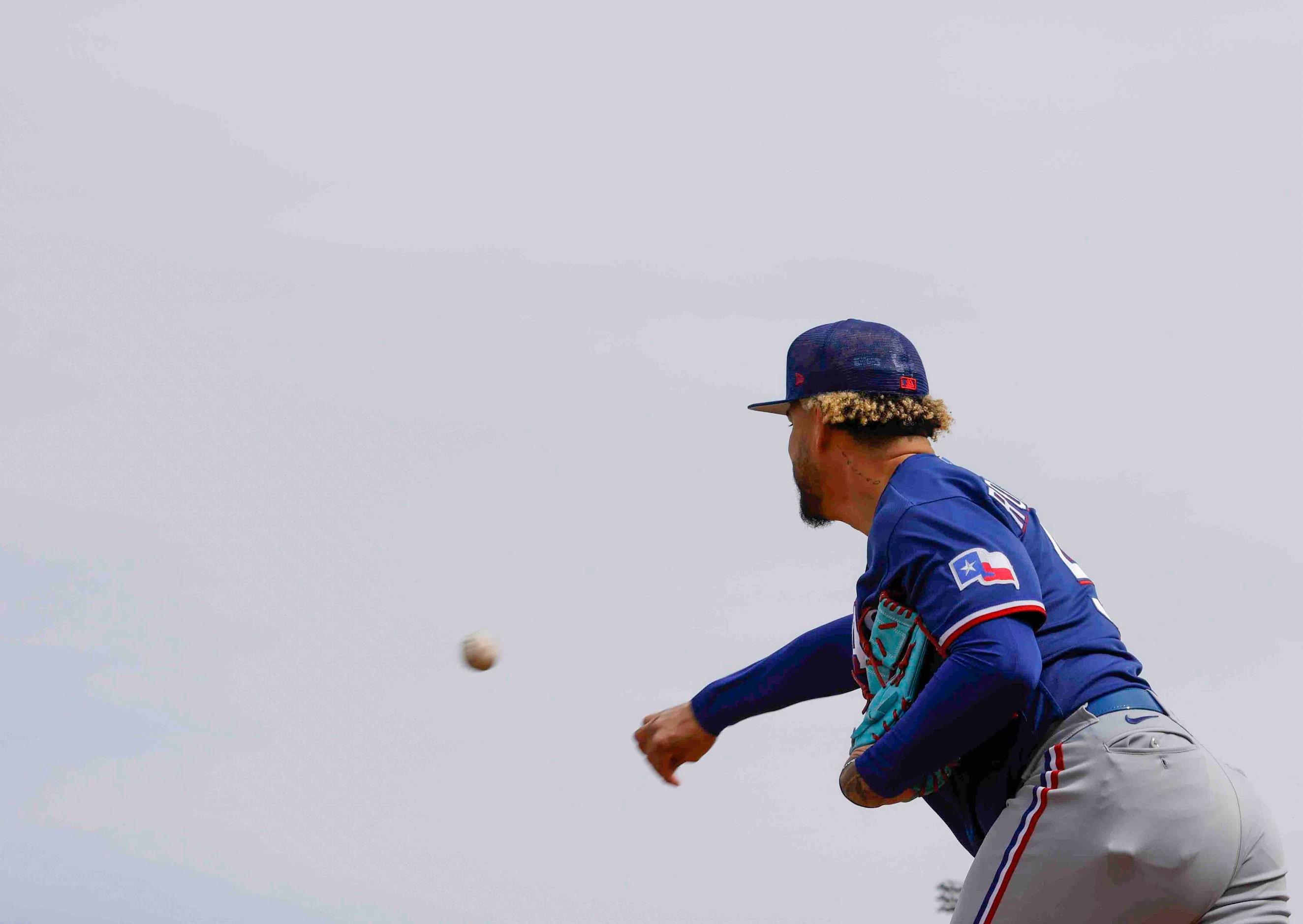 Texas Rangers pitcher Yerry Rodriguez throws a pitch during a spring training workout at the...