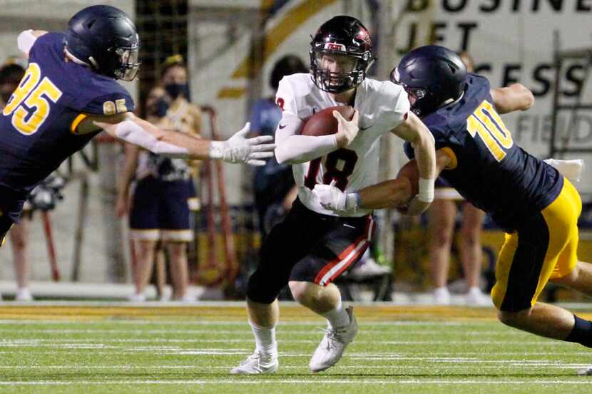 Coppell senior quarterback Ryan Walker (18) is nearly sacked on a play by Highland Park...