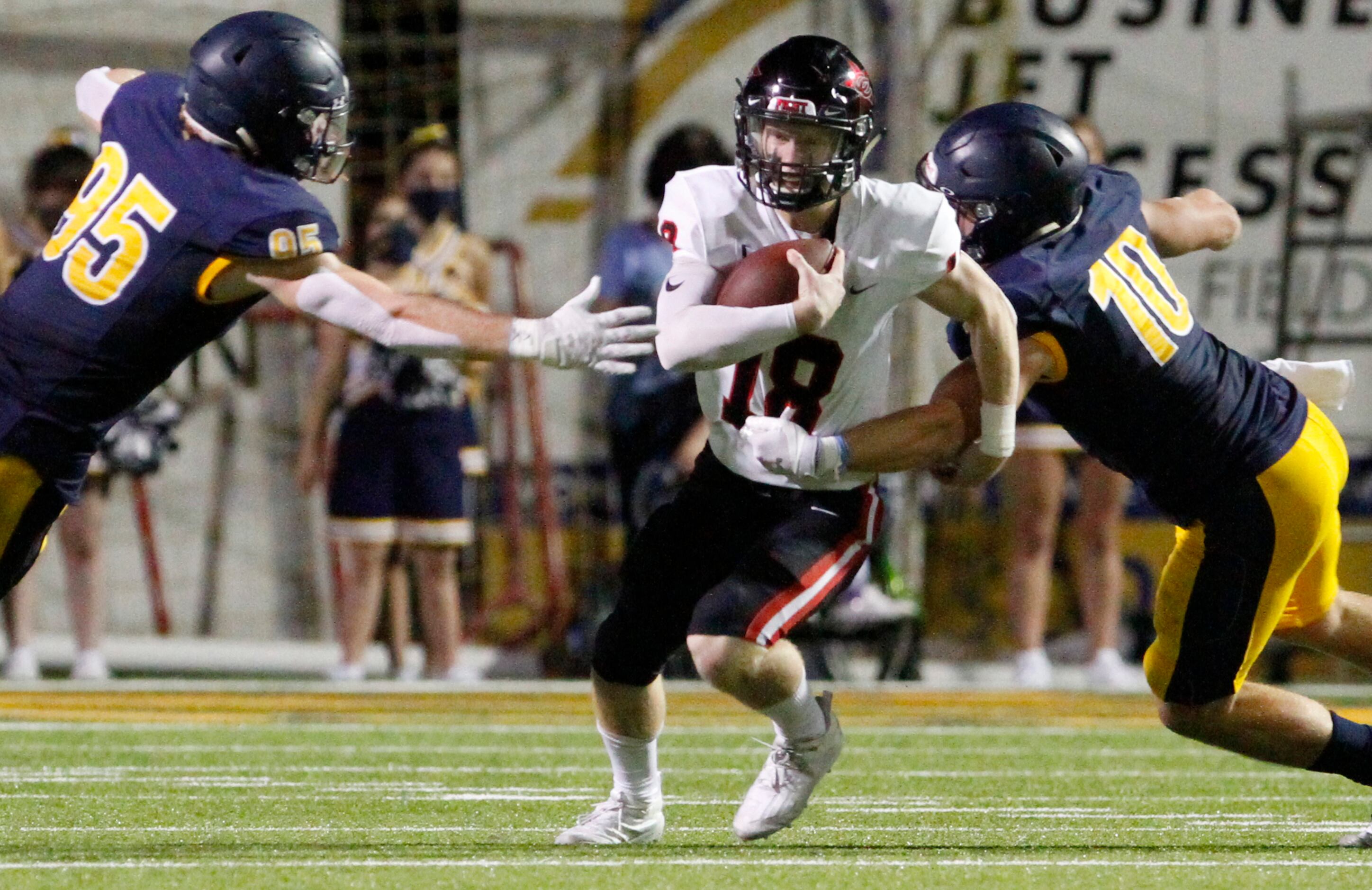 Coppell senior quarterback Ryan Walker (18) is nearly sacked on a play by Highland Park...