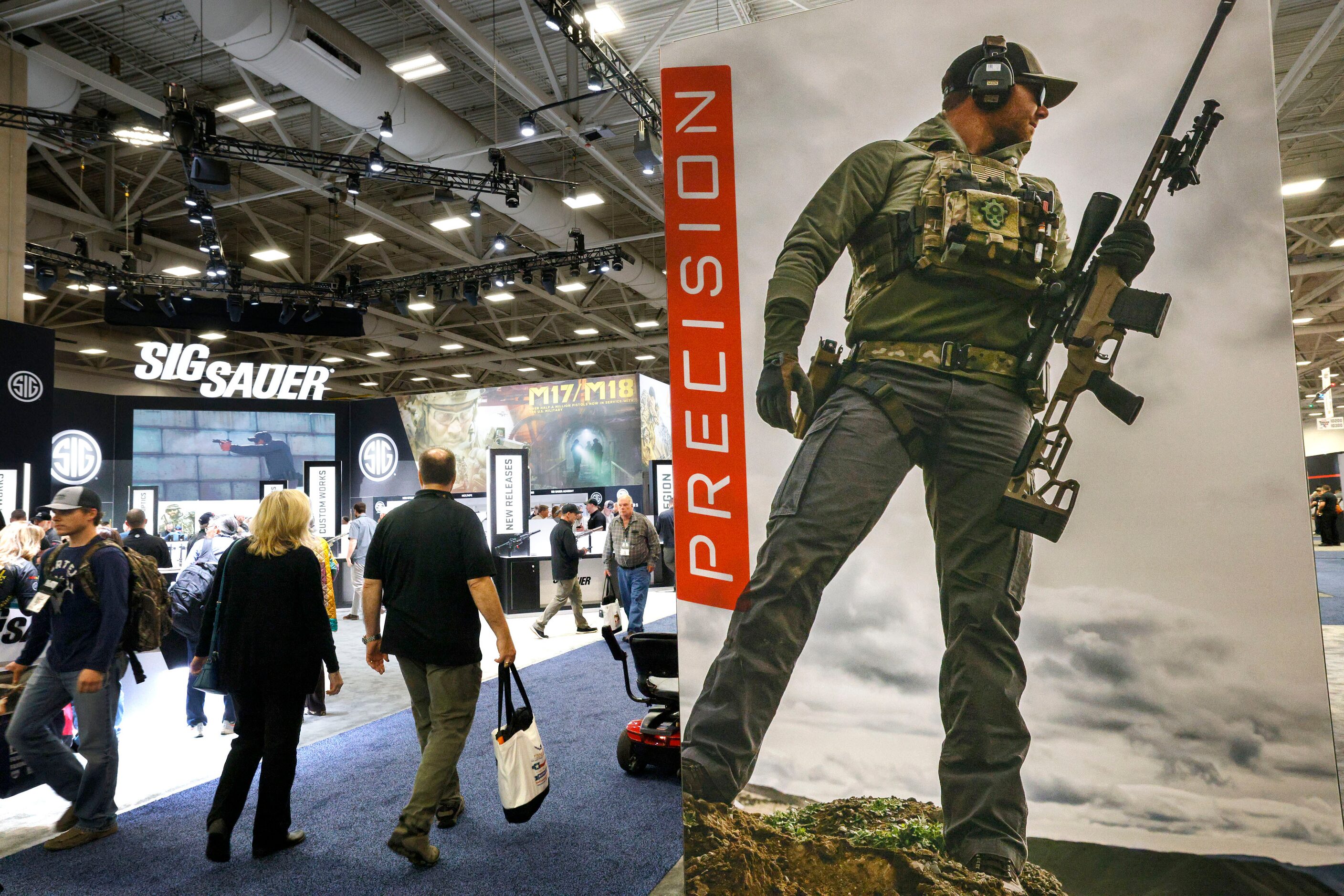 Visitors walk around during 2024 NRA Annual Meetings & Exhibits at Kay Bailey Hutchison...