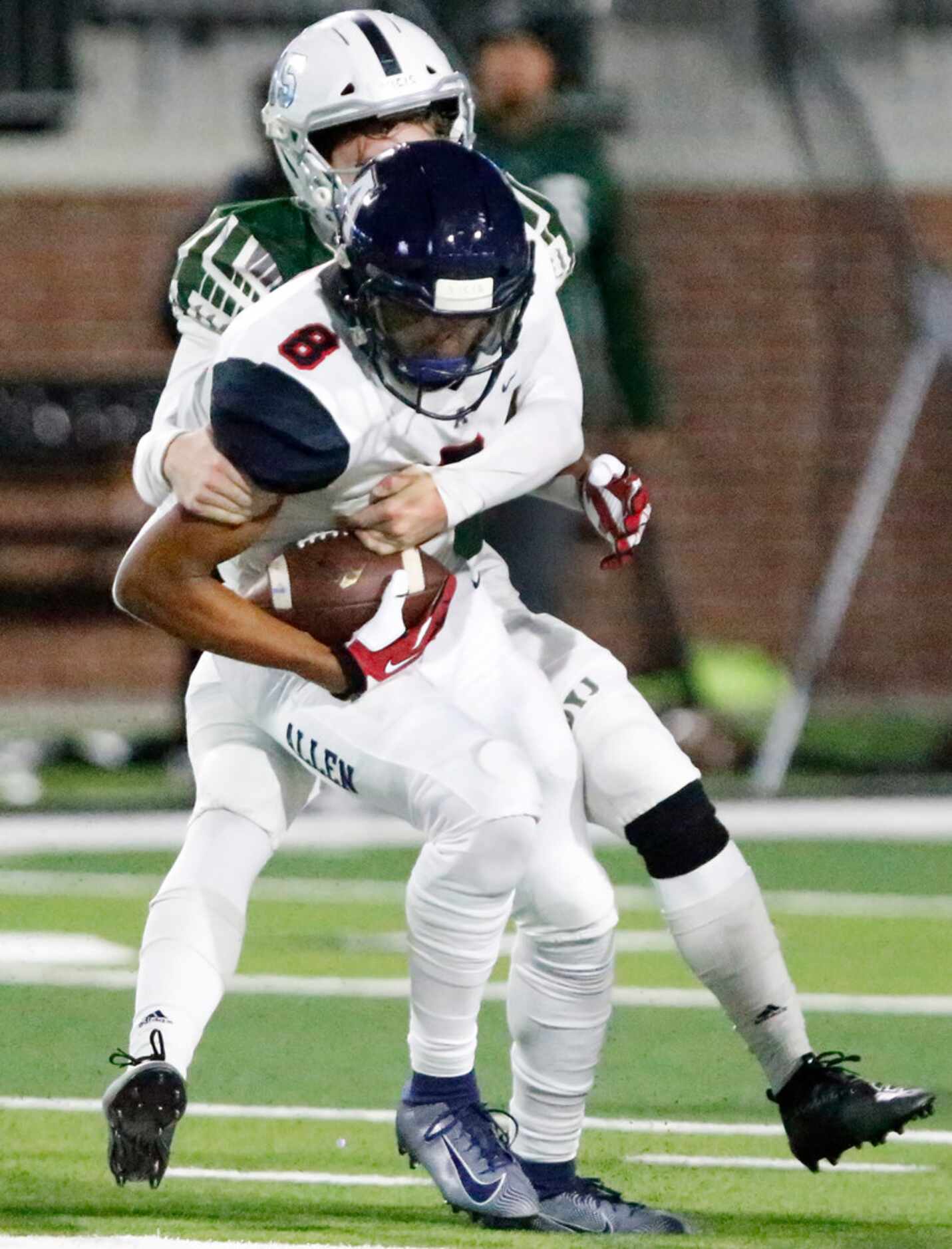 Allen High School wide receiver Blaine Green (8) is tackled by Prosper High Schoolâs Tate...