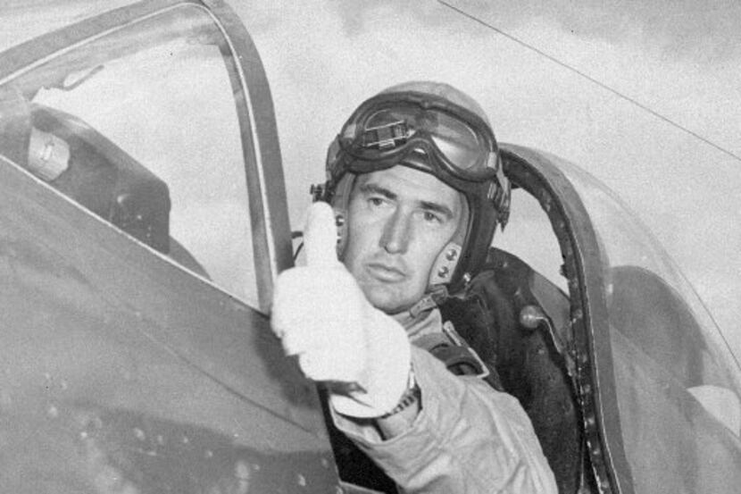 Ted Williams flashes the pilot's traditional thumb-up sign of  OK  to his mechanic while...