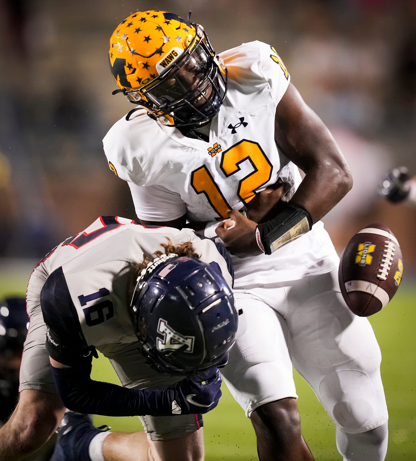 McKinney quarterback Keldric Luster (12) fumbles the ball as he is hit by Allen defensive...